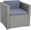 A single polyrattan armchair with grey-blue cushions, shown from a three-quarter angle on a white background. Produktbild-Vorschau