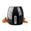 A black air fryer with a digital display showing "15" and a handle. There are several cooked chicken wings in front of and to the sides of the air fryer. Náhľad obrázku produktu
