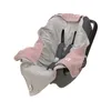 A baby car seat with a pink and gray blanket draped over it. Produktbild-Vorschau