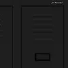 A close-up view of a black metal locker with ventilation slots and a nameplate area. Produktbild-Vorschau