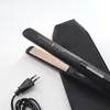 A black hair straightener with gold plates and a black storage pouch is laid out on a white surface, with its power cord and plug visible. Náhľad obrázku produktu