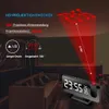 A digital alarm clock projecting the time onto a ceiling in a room with a sofa. Produktbild-Vorschau