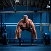 A muscular man performing a deadlift in a gym. Produktbild-Vorschau