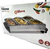 The image shows the packaging of a Tristar buffet server. The packaging is mostly white with colorful graphics and text. Voir les images du produit