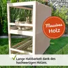 A wooden rabbit hutch with two levels, placed outdoors on grass with some greenery in the background. Produktbild-Vorschau
