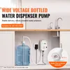 A water dispenser pump connected to a large water bottle under a kitchen counter, with faucets visible in the background. Náhľad obrázku produktu