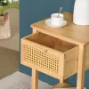A close-up of a wooden nightstand with an open drawer. Podgląd zdjęcia produktu