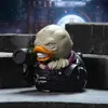 A collectible rubber duck toy resembling the Nemesis character from Resident Evil, posed on a stone surface with a dark, atmospheric background. Podgląd zdjęcia produktu