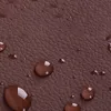 A close-up view of a brown textured surface with water droplets. Podgląd zdjęcia produktu