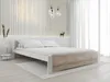 A bedroom with a bed, bedside table, and decorative elements. Náhled obrázku produktu