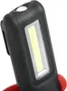 Close-up of a black and red work light with a white LED strip. Podgląd zdjęcia produktu