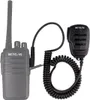 A black walkie-talkie with a coiled cord and speaker microphone attached, isolated on a white background. Produktbild-Vorschau