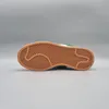 The bottom view of a sneaker on a gray background. Podgląd zdjęcia produktu