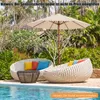 Outdoor lounge furniture and umbrella by a swimming pool. Anteprima dell’immagine prodotto