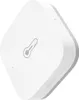 A white Aqara temperature and humidity sensor is shown against a white background. Voir les images du produit