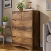 A wooden chest of drawers with plants and decorative items on top, placed in a room setting. Podgląd zdjęcia produktu