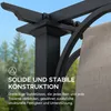 Close-up of a black pergola structure with a beige fabric canopy, set against a blurred background of trees and sky. Produktbild-Vorschau