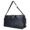 A black duffel bag with a shoulder strap, shown against a white background. Produktbild-Vorschau