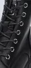 A close-up view of the lacing and eyelets of a black boot. Produktbild-Vorschau