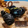 A remote-controlled car on a sandy, rocky terrain. Voir les images du produit
