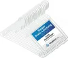 A stack of white plastic clothes hangers with a label on them. Produktbild-Vorschau