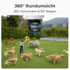 A surveillance camera is shown in a backyard setting with dogs and a child, illustrating its tracking capabilities. Produktbild-Vorschau