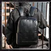A person wearing a black jacket and a black backpack, standing on a wooden staircase. Anteprima dell’immagine prodotto