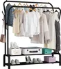 A black metal garment rack filled with various clothing items and accessories, with storage boxes and shoes on the lower shelves. Náhled obrázku produktu