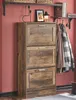 A hallway or entryway scene with a shoe cabinet, coats hanging on hooks, and shelves above. Produktbild-Vorschau