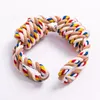 A dog toy made of braided rope with multiple colors. Produktbild-Vorschau