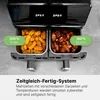 A dual-basket air fryer with food inside, showcasing different cooking settings. Voir les images du produit