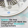 Close-up view of a ceiling fan's central motor housing with a built-in Bluetooth speaker, accompanied by German marketing text. Produktbild-Vorschau