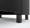 Close-up view of the bottom of a black minimalist sideboard, showing its legs and base. Produktbild-Vorschau
