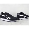 A pair of black Reebok sports shoes with white accents are displayed on a light gray textured surface. Produktbild-Vorschau
