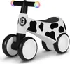 A white and black cow-print balance bike with colorful lights on the handlebars, shown against a white background. Náhled obrázku produktu