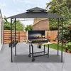 A backyard patio with a grill gazebo and a barbecue grill set up underneath. Voir les images du produit
