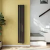 A modern interior with a vertical radiator against a yellow wall and a staircase on the right. Náhled obrázku produktu