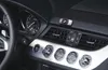 A close-up view of a car's interior dashboard, focusing on the air vents and control knobs. Produktbild-Vorschau