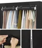 A collage of images showing a fabric wardrobe with clothes hanging inside, a close-up of a hand fastening a strap, and a close-up of a zipper. Produktbild-Vorschau