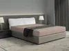 A bed with beige fitted sheets and white pillows, set in a modern bedroom with bedside tables and lamps. Produktbild-Vorschau