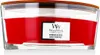 A close-up, front-facing view of a red WoodWick candle in a clear glass jar with a wooden lid. Produktbild-Vorschau