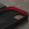 Close-up view of the inside of a black iPhone case with red trim and a hexagonal pattern. Produktbild-Vorschau