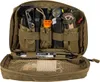 An open pouch filled with various survival and everyday carry items. Náhled obrázku produktu
