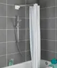 A shower curtain rod with multiple arms and a white shower curtain hanging from it, installed in a tiled bathroom. Produktbild-Vorschau