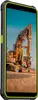 A rugged smartphone is shown in front of a construction site with an excavator. Náhled obrázku produktu