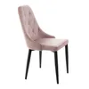 A pink velvet dining chair with black legs, shown from a side angle against a white background. Náhľad obrázku produktu