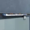Close-up of a sliding glass door mechanism attached to a track on a wall. Produktbild-Vorschau