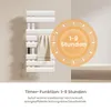 A white electric towel warmer with a towel draped over it, next to a circular graphic highlighting a timer function. Náhľad obrázku produktu