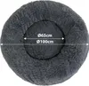A dark gray, plush, round dog bed with size indicators. Anteprima dell’immagine prodotto