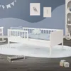 A child's bedroom with a white toddler bed, bedding, and decorative elements. Produktbild-Vorschau